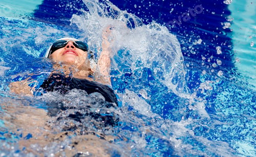 Preview: Woman Swimming At The Pool On Her Back