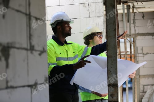Preview: Architect and construction engineer or surveyor discussion plans and blueprints