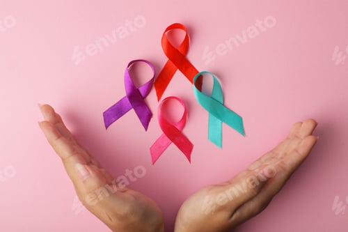 Preview: Hands Protect Colorful Cancer Ribbon To Support People Illness. World Cancer Day.