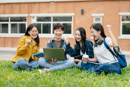 Preview: Young Asian People college students and a female student group work at the campus park in morning