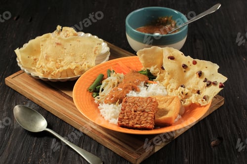 Preview: Nasi Pecel. Traditional Javanese Rice Dish of Steamed Rice with Vegetable Salad, Peanut Sauce