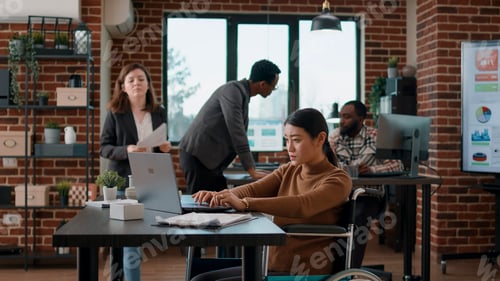 Preview: Female colleagues analyzing business charts on documents