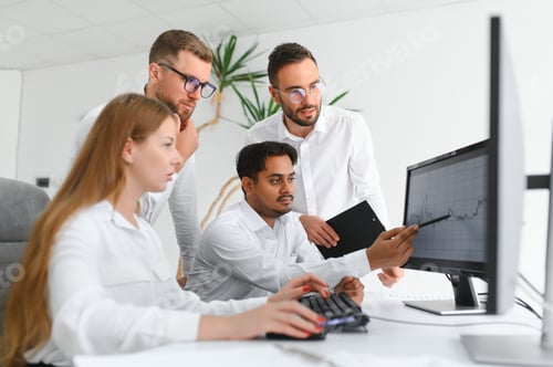 Preview: Group of young business people in smart casual wear working together in creative office