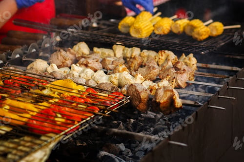 Preview: Delicious vegetables grilling on open grill, outdoor kitchen