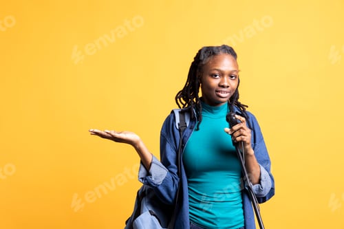 Preview: Confident woman uses mic, inspiring motivation with discourse, studio background