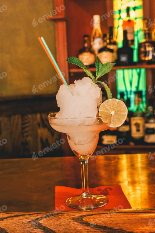 Preview: Citrus cocktail on a wooden bar table
