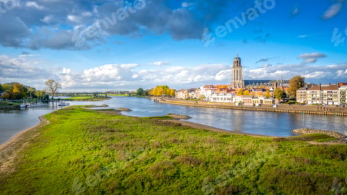 Preview: Scenic view of the town of Deventer along a river in the Netherlands