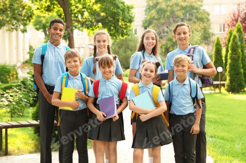 Preview: Group of children in stylish school uniform outdoors