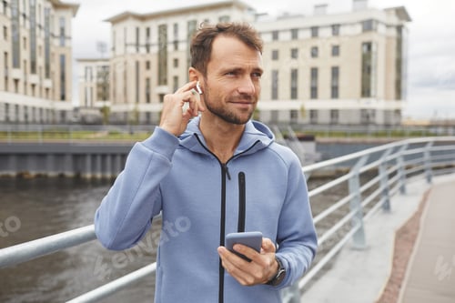 Preview: Man listening to music