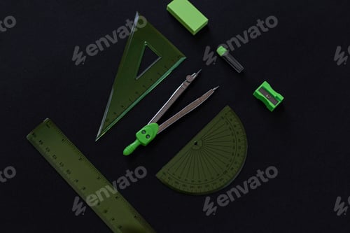 Preview: geometry set with rulers, compass, eraser, sharpener and graphite rods on black background