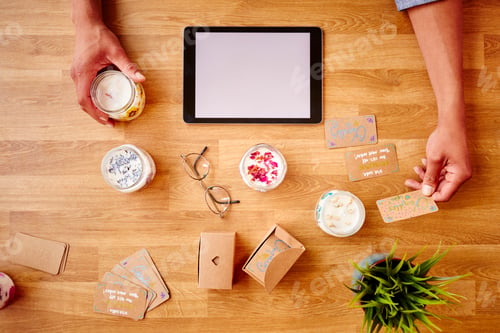 Preview: Close Up Of Man Running Online Business Making Boutique Candles At Home With Digital Tablet