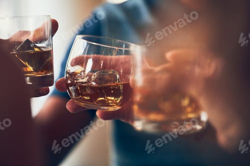 Preview: Closeup shot of many people clinking glasses with alcohol at a toast