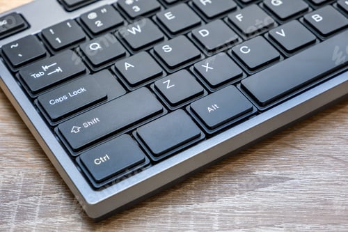 Preview: Close up of black keyboard on office desk.
