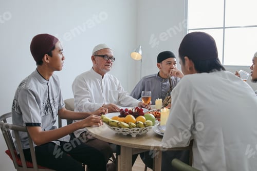 Preview: Muslim Family Talking While Eating Together on Ramadan Moment