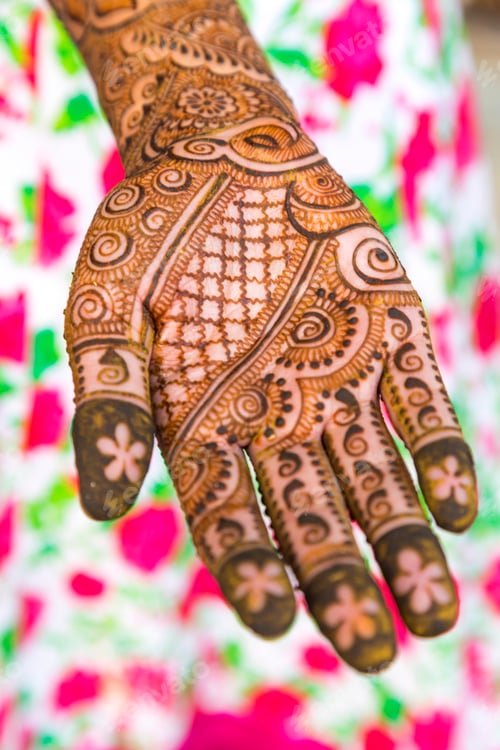 Preview: Female hand covered in Henna tattoos