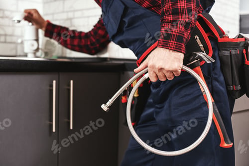 Preview: New plumbing. Close-up of foreman checking all things before start faucet
