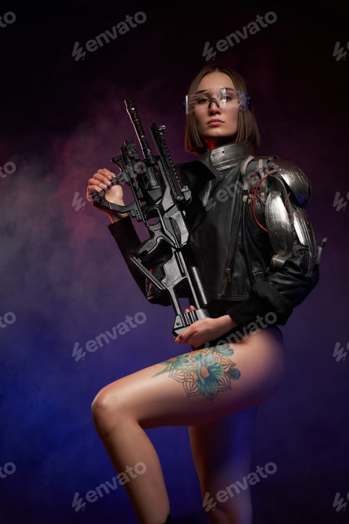 Preview: Woman with cybernetic arm poses with rifle in dark background