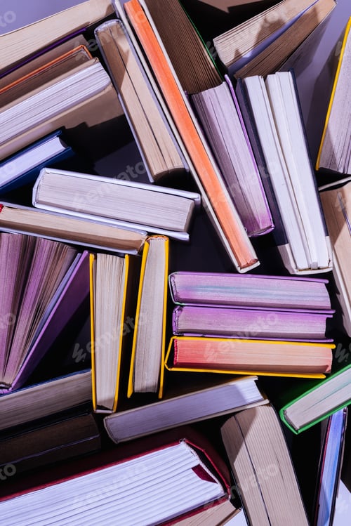 Preview: top view of scattered stack of books on table