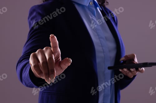Preview: Biracial businesswoman using smartphone with copy space on grey background