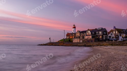 Preview: Urk Flevoland Netherlands sunset at the lighthouse and harbor of Urk Holland