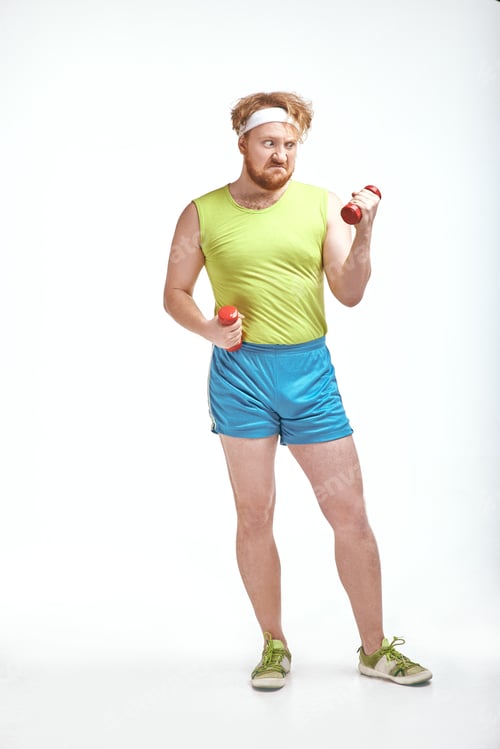 Preview: Red haired, bearded, plump man is holding the dumbbells