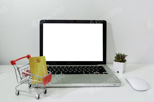 Preview: Computer laptop mock up blank white and cart and credit card on desk.