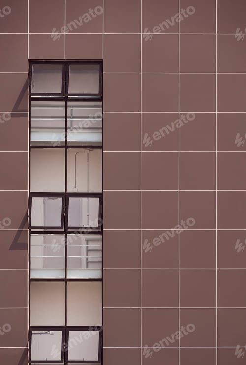Preview: Row glass window on brown aluminum composite tiles wall of modern office building
