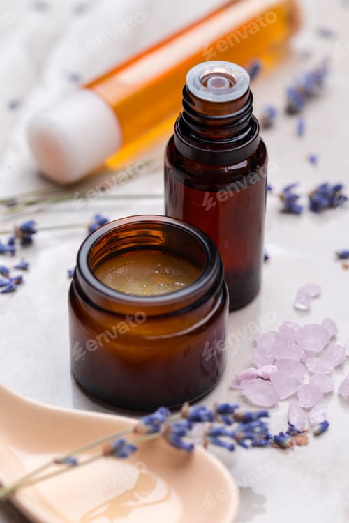 Preview: Natural skincare products arranged with lavender and crystals on a light background