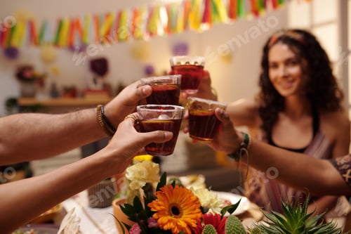 Preview: Holding glasses of tequila during toast