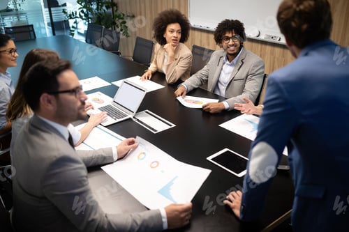 Preview: Successful group of business people at work in office