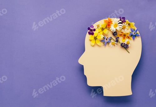 Preview: World mental health day concept. Human head symbol and flowers on a violet background