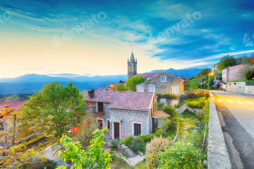 Preview: Majestic evening cityscape with Parish Church of the Assumption in Zonza village
