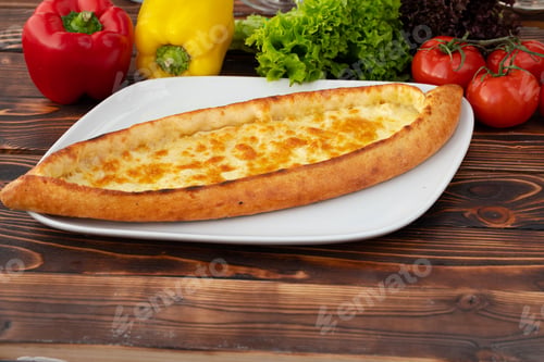 Preview: Close up of Turkish Pide bread on wooden table