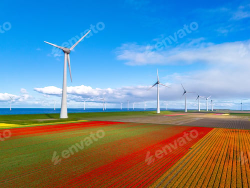 Preview: offshore windmill park with clouds and a blue sky, windmill park in the ocean drone aerial view with