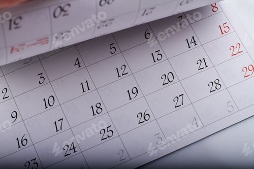 Preview: Turning month calendar page sheets with dates closeup-up.