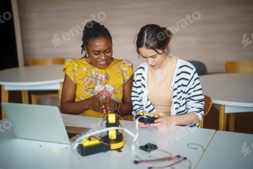 Preview: Young students learning electronics and circuitry skills in a modern classroom setting