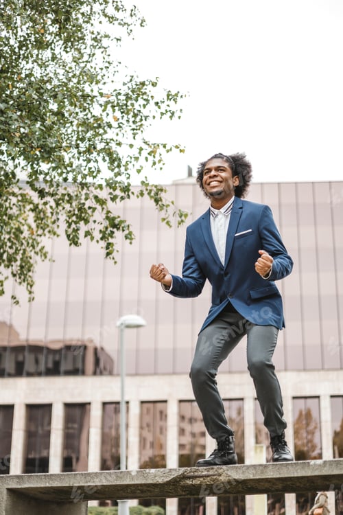 Preview: successful african businessman jumpin with excitement
