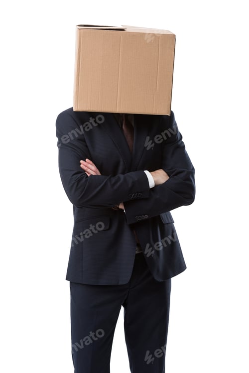 Preview: businessman with cardboard box on head and crossed arms, isolated on white