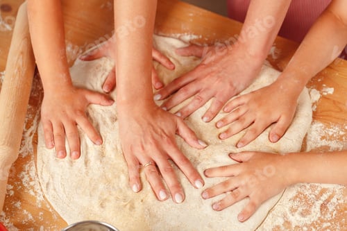 Preview: Woman with her children kneading dough in kitchen