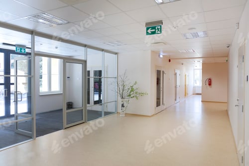 Preview: A modern school building, a wide corridor and hallway, light and airy, glass doors.