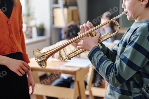 Preview: Kid Playing Brass Instrument During Music Class