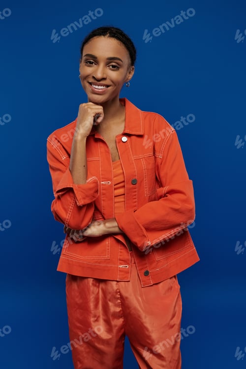 Preview: Vibrant essence: african american woman flaunting orange attire