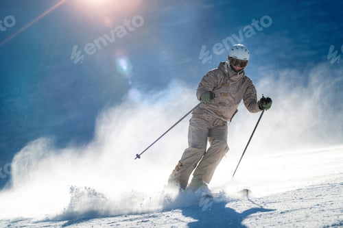 Preview: Female skier skiing down the slope