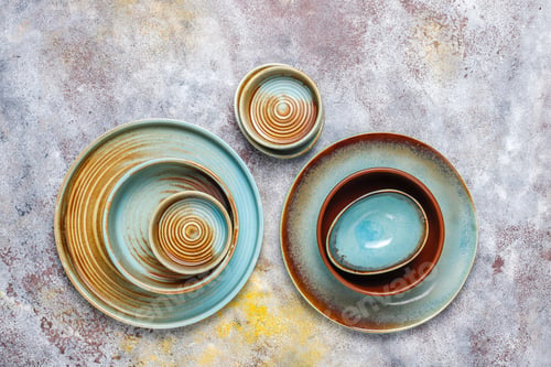 Preview: Different ceramic empty plates and bowls.