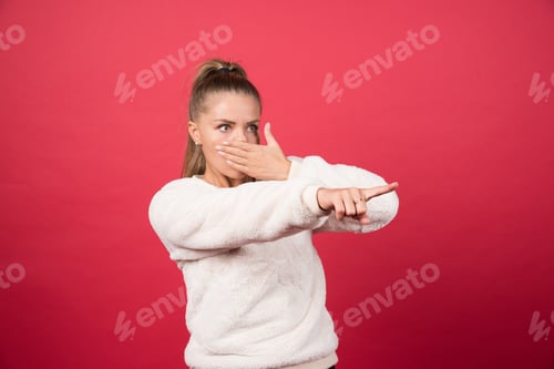 Preview: Image of a happy woman pointing a finger away