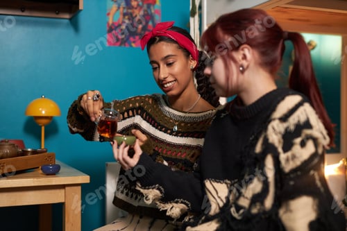 Preview: Girl Pouring Tea For Her Friend
