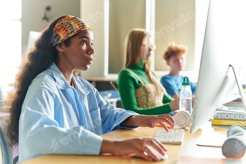 Preview: Students learning on computers at class