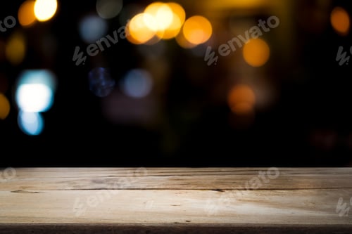 Preview: Empty table on abstract night bokeh background.