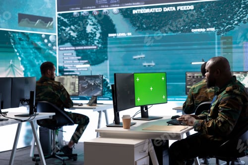 Preview: Soldier gathering real time surveillance data next to mockup display