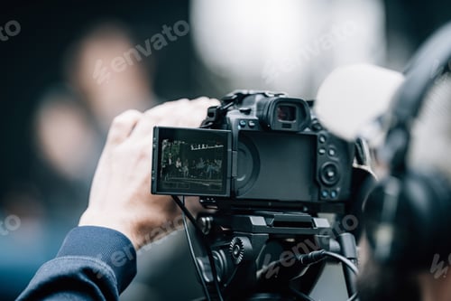 Preview: Camera at a panel discussion conference